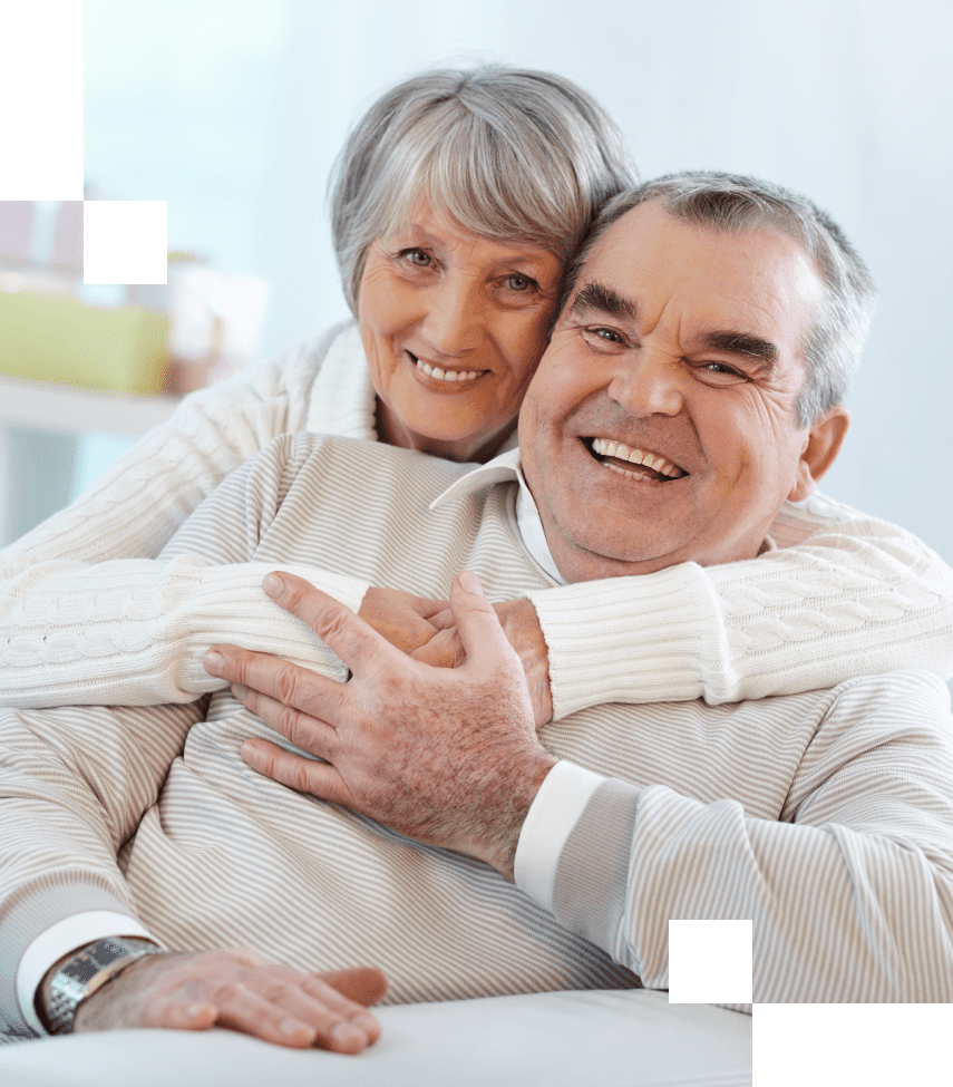 Happy senior couple enjoys retirement by working through the stages of decision making with a Sage Senior Transitions specialist.